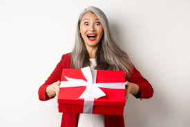 This is one of the best birthday presents for girlfriend, if you really love her. Premium Photo Attractive Boyfriend Pointing Finger At Valentines Day Surprise Gifts Showing Romantic Presents For Girlfriend Standing Against Blue Background
