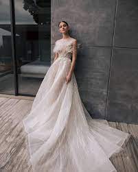 Nicole Felicia On Instagram Delicate Ostrich Feathers Highlight The Beauty Of This Ethereal Minimal Wedding Dress Bridal Couture Simple Wedding Dress Beach