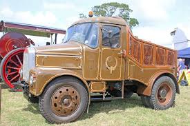 Lorry with Brown Shipping Container in Motion