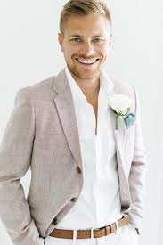 Male Attire For An Abroad Wedding In The Sun Relaxed But Chic Beach Wedding Groom Mens Wedding Attire Beach Wedding Groom Attire For a laid back but still stylish beach wedding attire for men, combine a pair of tailored (as opposed to more casual draw string) white linen pants, a crisp tailored shirt (striped will look very nice or else something like the white shirt featured in the picture. beach wedding groom