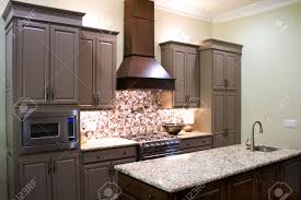Ceiling height for kitchen cabinets. New Modern Luxury Kitchen Cabinets With Gas Stove And Granite Stock Photo Picture And Royalty Free Image Image 29666624