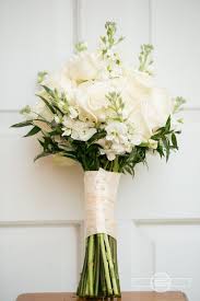 Tie together their small bouquets with long ribbon, allowing it to cascade down for an airy effect. Simply Elegant Bridal Bouquet White Wedding Bouquets Wedding Flowers Wedding Bouquets