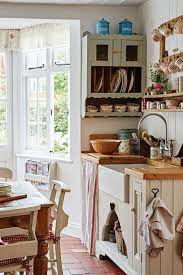 This english country kitchen features dark stained wood floors, handmade green tiles and gorgeous crystal chandelier for a glam feel. Follow The Yellow Brick Home How To Achieve The English Country Kitchen Look Follow The Yellow Brick Home