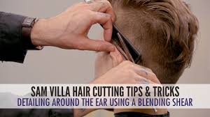 Flip out short layered bob Detailing Around The Ear With A Blending Shear Men S Haircut