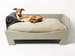 Large dog beds or pillows for dogs make the dog feel protected during sleep and rest. Raised Wooden Dog Bed Charley Chau Luxury Dog Beds Blankets