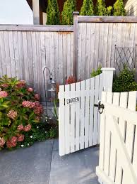 My favorite picket fences have arbors over the gates, and i'm hoping we can do some arbors over our gates this summer. White Picket Garden Gates Autumn Hydrangeas The Inspired Room