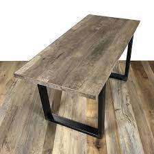 The kingsbridge industrial reclaimed oak dining table features a solid wood table top designed in a herringbone style. Reclaimed Oak Dining Table Table Plates