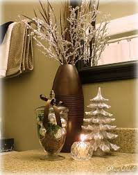 A Bathroom Gets Some Silver Frostiness For Christmas Silver Ornaments Faux Greenery And B Christmas Bathroom Decor Holiday Wall Decor Christmas Decorations