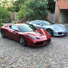 ferrari 458 speciale painted in rosso fiorano w black racing stripes and a porsche 991 turbo s painted in silver photo taken by woppum on instagram