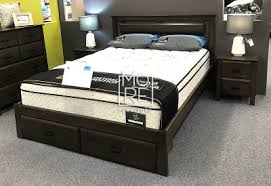 The above bed is a minimalistic dark wood bed frame with six sleek, subtle drawers; Double Bed Frames Antonio Nz Pine Solid Timber With Storage Bed Frame