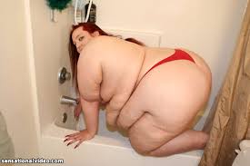 Ugly overweight woman Demisis poses naked in the bathroom and takes a shower