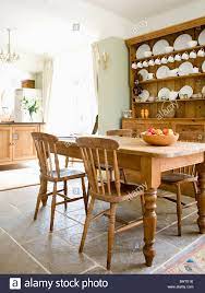 Old Pine Table And Chairs In Country Kitchen With Pine Dresser And Flagstone Floor Stock Photo Country Kitchen Tables French Kitchen Table Country Kitchen