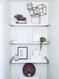 Modern Over The Toilet White Bathroom Ikea Shelves Simple Decor Plants Bathroom Shelf Decor Ikea Bathroom Shelves Ikea Shelves
