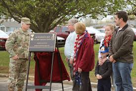 Maj. Gen. Arlan DeBlieck un veils the plaque that dedicates