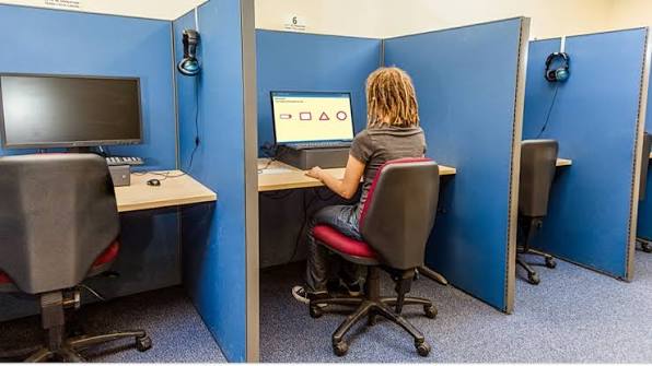 Candidate taking a computerized Driver Theory Test inside an official RSA examination workstation in Ireland, Mock Theory Test Ireland - Pass Your Theory Test 1st Time!
