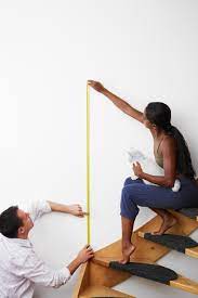 Groupings of smaller pictures should go along the staircase diagonally, at least 60 inches from the bottom of each stair. Hanging Pictures Above Stairs Tricks That Won T Trip You Up Faux Sho