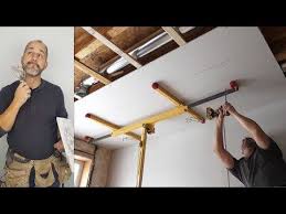 How To Install Ceiling Drywall Using A Panel Lift Youtube Drywall Ceiling Install Ceiling Light