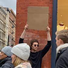Guy Holding Cardboard Sign Meme Generator Imgflip