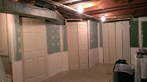 Finishing The Basement Hide Cover Enclose The Furnace And Hot Water Tank I Propped The Doors For Basement Makeover Basement Remodeling Basement Construction