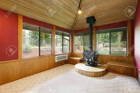 The wood look ceiling collection offers ceiling planks in a variety of finishes and two sizes and materials. Bright Empty Living Room Interior With Red Accent Walls Vaulted Wood Plank Ceiling And Black Log Burner By The Windows Northwest Usa Stock Photo Picture And Royalty Free Image Image 96591377