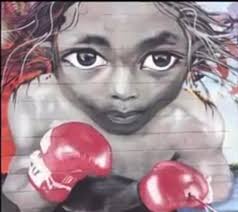 Behind a strip mall shopping center