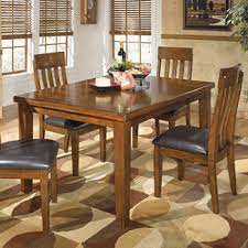Check out our wide selection of full dining hall table and chair sets to find a great price on great brands like cindy crawford , eric church and sofia vergara , in traditional , rustic , transitional , formal , dining sets under $500 , and more. Signature Design By Ashley Dining Room Sets
