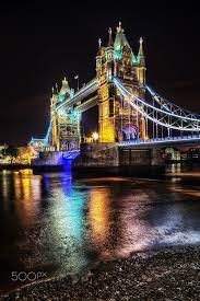 It crosses the river thames near the tower of london. Tower Bridge At Night London England By Christian Muller On 500px Tower Bridge London London Night London Travel