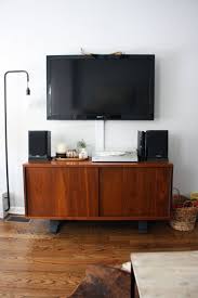 Use cord clips to hide your wires behind a tv stand. Ways To Hide Your Tv Cords