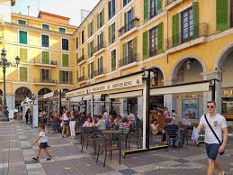 people sitting outdoor cafe at placa major in palma de mallorca spain in 2021 palma de mallorca outdoor cafe mallorca