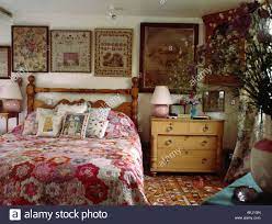 Framed Antique Samplers Behind Bed With Patchwork Quilt In Country Bedroom With Pine Chest Of Draw Country House Decor Home Decor Bedroom Country Style Bedroom
