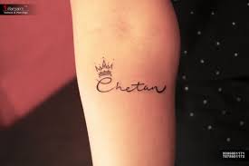 Crispy Name Tattoo With Crown Aaryans Ahmedabad Gujarat India Call Whatsapp For Appointments 9099801 Name With Crown Tattoo Red Tattoos Creative Tattoos