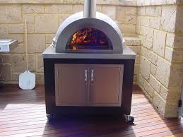 A Set Of Doors And A Pizza Oven On A Movable Trolley Make Outdoor Cooking Easy Woodfired Pizza Oven Woodfired Oven Wood Fired Pizza Oven