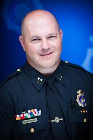 Meet another member of our Senior Command Staff, Deputy Chief Kerry  Neumann. You might say Deputy Chief Neumann wears many hats, of course,  they're all police hats. Managing the Police Services Bureau,
