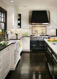 The dark wood floors serve as a great contrast for the white cabinets, but also compliment the dark grout of the backsplash. Modern Kitchen Design Kitchen Inspirations Kitchen Remodel Kitchen Design
