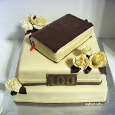 Birthday cakes are often layer cakes with frosting served with small lit candles on top representing the celebrant's age. Anniversary Cake Decorating Photos