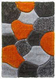 The whiteness of the wool yarns can also differ depending on the time of the year the sheep are sheared. Luxus Stones Shaggy Rug Grey Orange