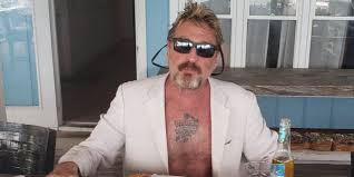 — john mcafee slides out suddenly from behind a glass door. Mcafee Says He Won T Pay 25 Million Judgment Ordered Over 2012 Death Of Belize Man Florida Record