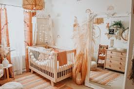 Pair boho room décor like wicker furniture with soft throw pillows in natural colors. Boho Baby Nursery Project Nursery