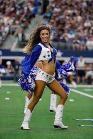 The Dallas Cowboys Cheerleaders Perform During An Nfl Football Game Against The Miami Dolphins In A Dallas Cowboys Cheerleaders Dallas Cowboys Nfl Cheerleaders