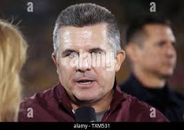 Arizona State head coach Todd Graham makes a call during the first half of  the Cactus Bowl NCAA college football game against West Virginia, Saturday,  Jan. 2, 2016, in Phoenix. (AP Photo/Ross