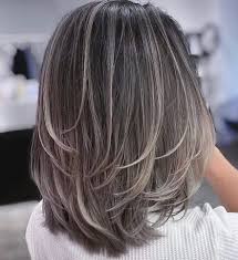 Medium hairstyle with layered ends. 50 Medium Haircuts For Women That Ll Be Huge In 2021 Hair Adviser