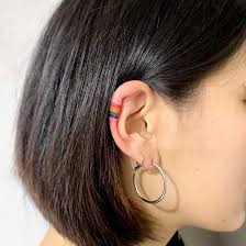 Maybe you would like to learn more about one of these? Tiny Rainbow Tattoo On The Right Ear Tattoogrid Net