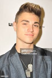 Hair stylist Aaron Grenia prepares backstage during the "Victor de... News  Photo