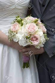 We would like to show you a description here but the site won't allow us. Bride And Groom With Wedding Bouquet Of White And Pink Roses Stock Photo Picture And Royalty Free Image Image 15167133