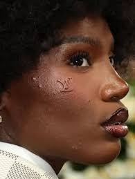 I was expecting her to come draped down in some Dapper Dan. She chose  “European branding”. This was a total disappointment.