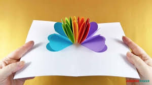 Add glue to one side of one half heart and press a second heart on top of this, so two heart are sticking together. Make A Pop Up Heart Rainbow Card Jennifer Maker