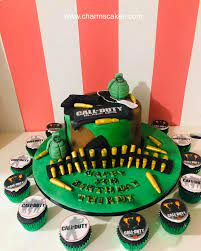 Creating a spiderweb icing design on top of a cake. Charm S Cakes Bandolier Custom Cake