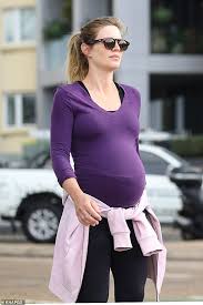 Adam goodes was voted australian of the year in 2014, but a year later decided to walk away from his brilliant afl career with the sydney swans. Ex Afl Star Adam Goodes Steps Out With Heavily Pregnant Wife Natalie Croker Daily Mail Online