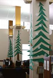Decorate The Office With Paper Trees On Pillars And Walls Office Christmas Decorations Christmas Door Decorations Office Christmas