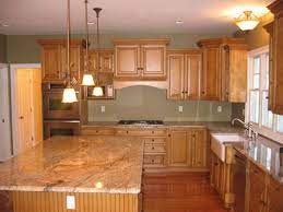 Wood kitchen cabinets are amongst the admired ones as they are easy to handle, can be found in an array of colour schemes. Kitchen Color Design With Tan Wood Cabinets Homes Modern Wooden Kitchen Cabinets Desig Kitchen Cabinets And Countertops Kitchen Design Cheap Kitchen Cabinets